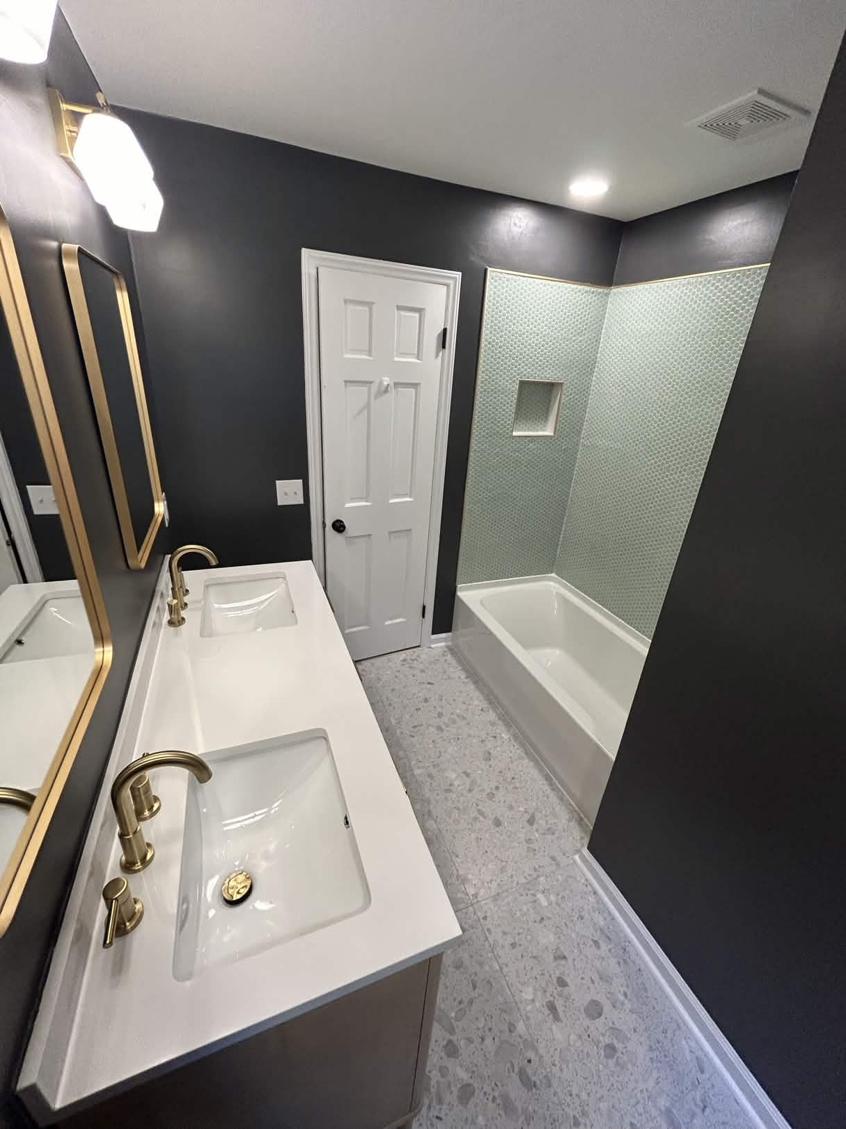 Dark accent bathroom with penny tile