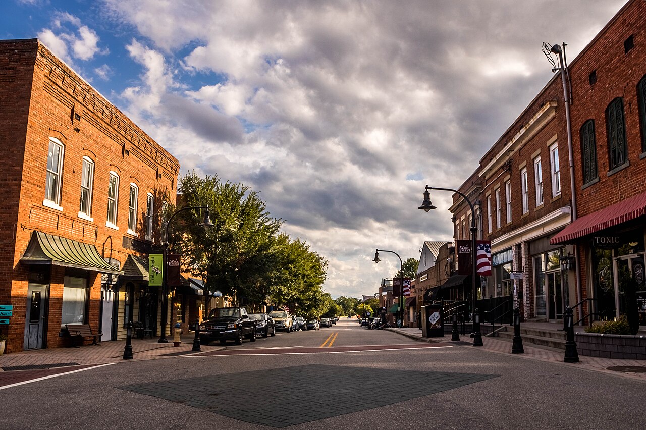 Brick storefronts and sidewalks along White Street in downtown Wake Forest